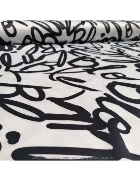 zoom Satin polyester légèrement strech original noir blanc - tissus habillement au mètre Biarritz