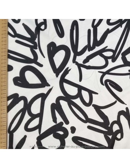 Satin polyester légèrement strech Bla Ble Bli Blo Blu mot noir blanc - tissu habillement au mètre Biarritz